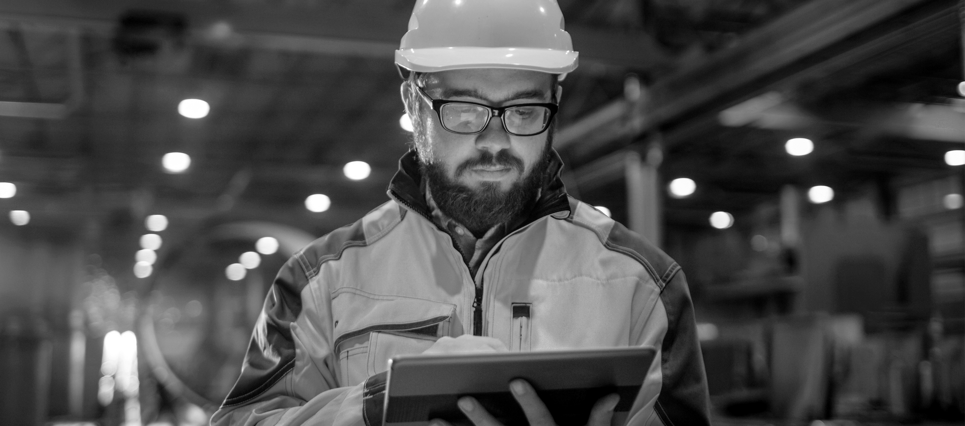 Medium PNG-SINGLE-IMAGE_man-with-hard-hat-looking-at-tablet-no-squares_mar24