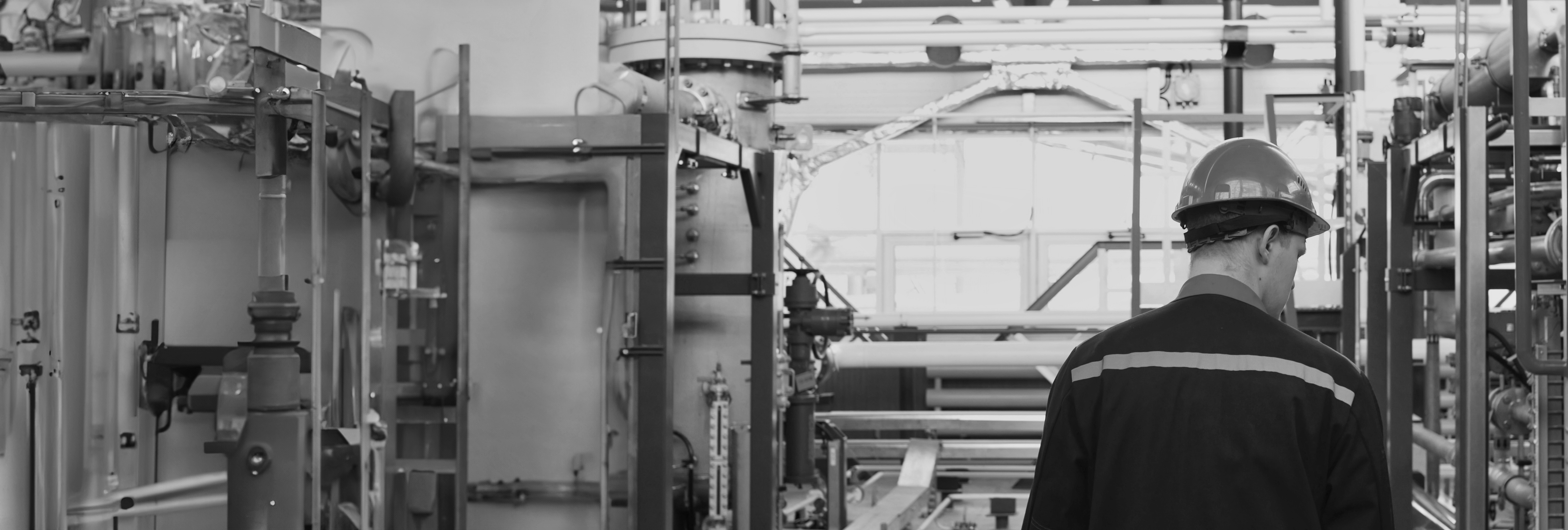 SINGLE-IMAGE_worker-hard-hat-checking-equipment-extended_sept24