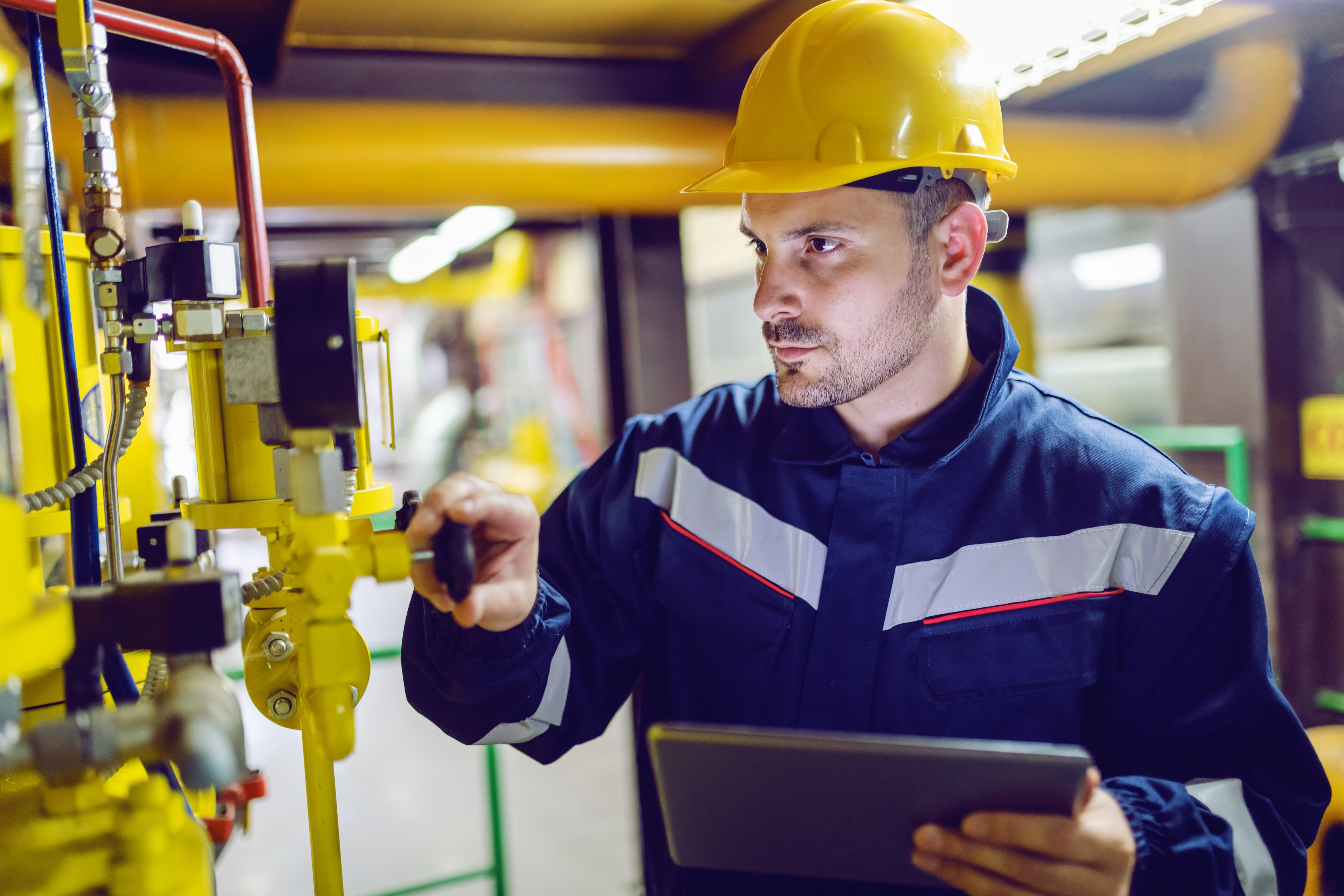 plant worker in energy industry using EHS software